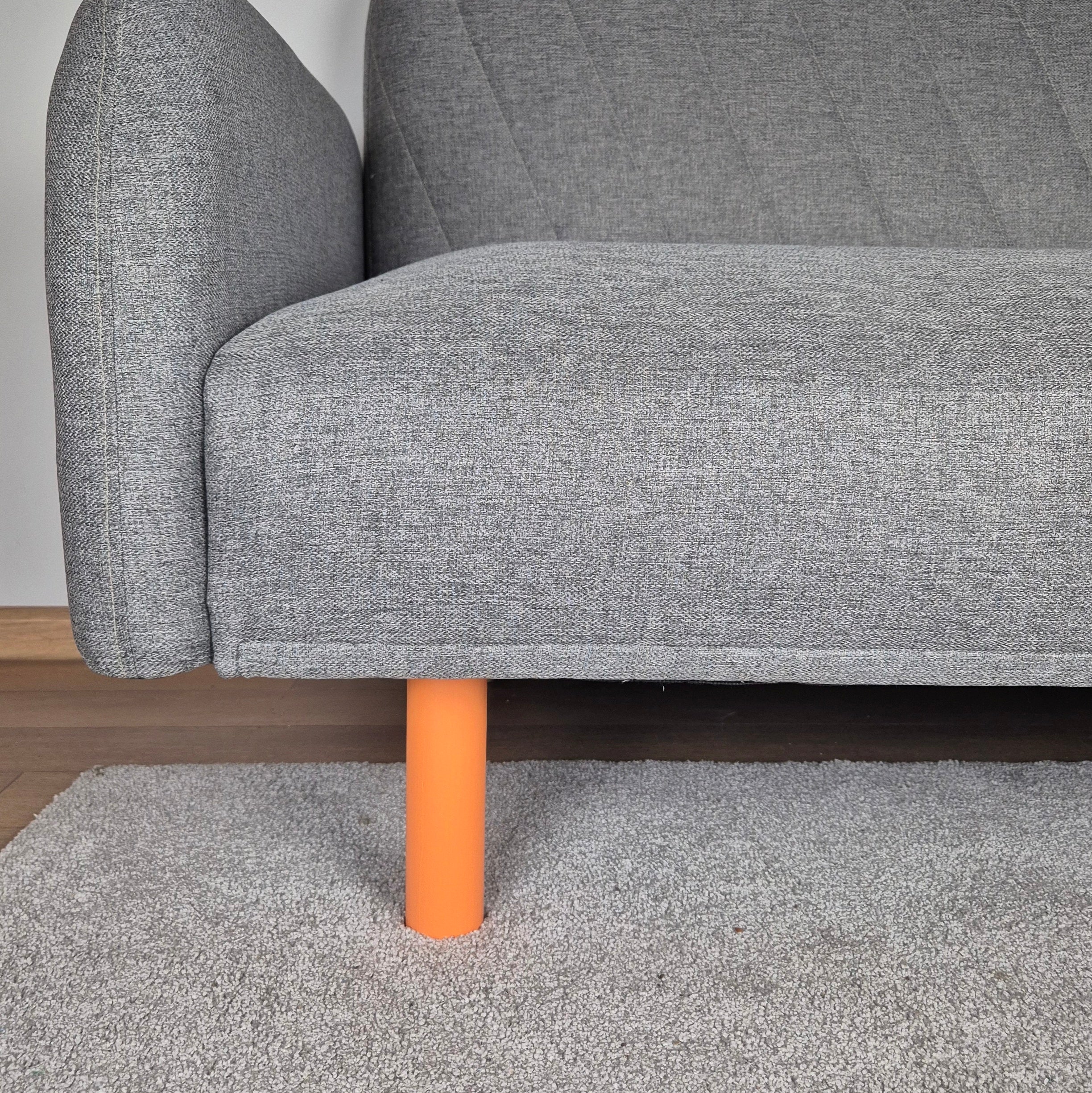 gray sofa with orange legs