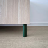 green cabinet leg