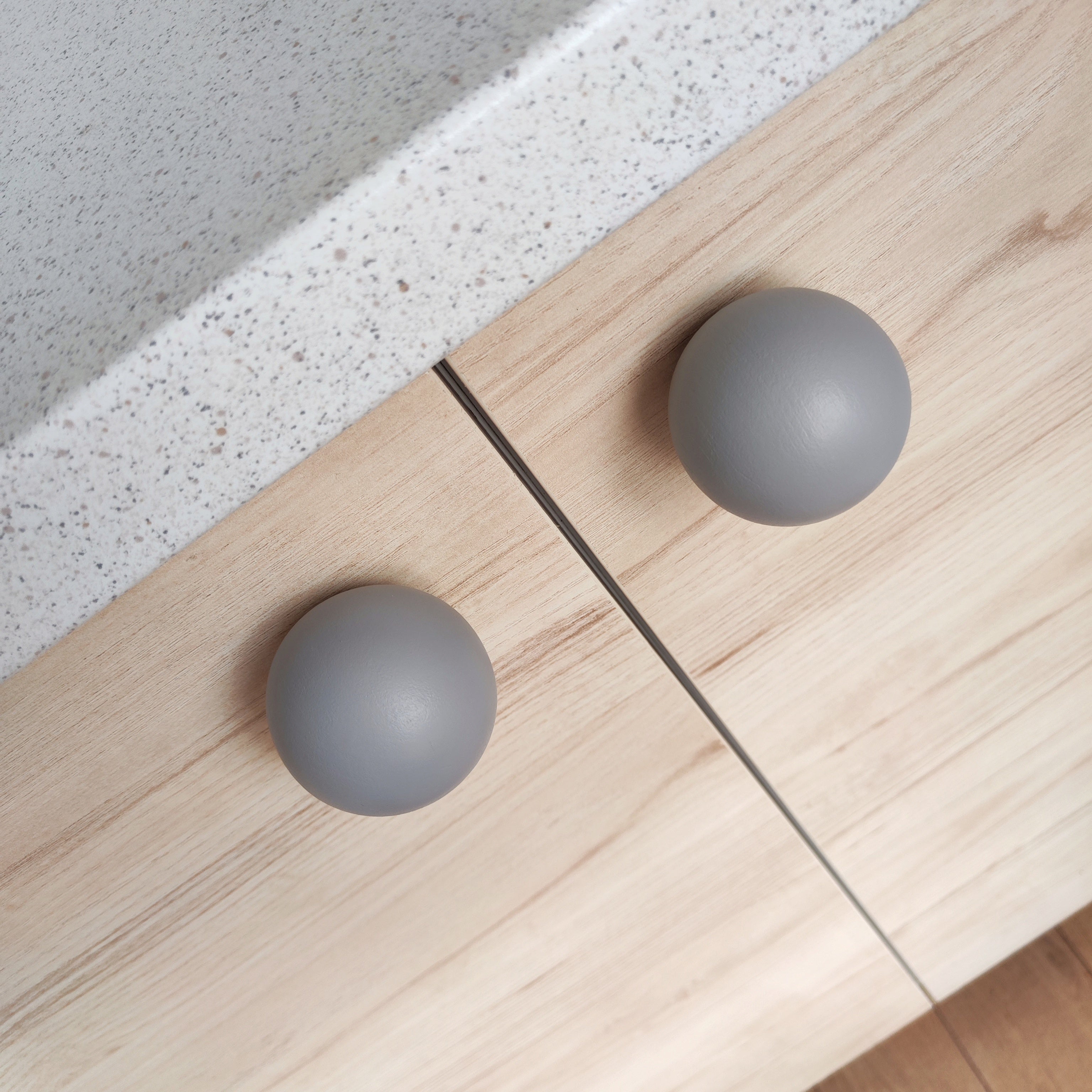 Grey knobs for kitchen furniture