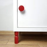 red cabinet leg and knob