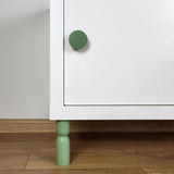 green cabinet leg and knob