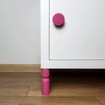 Pink knob and leg on KALLAX cabinet