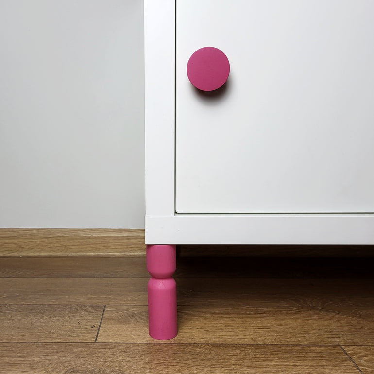 Pink knob and leg on KALLAX cabinet