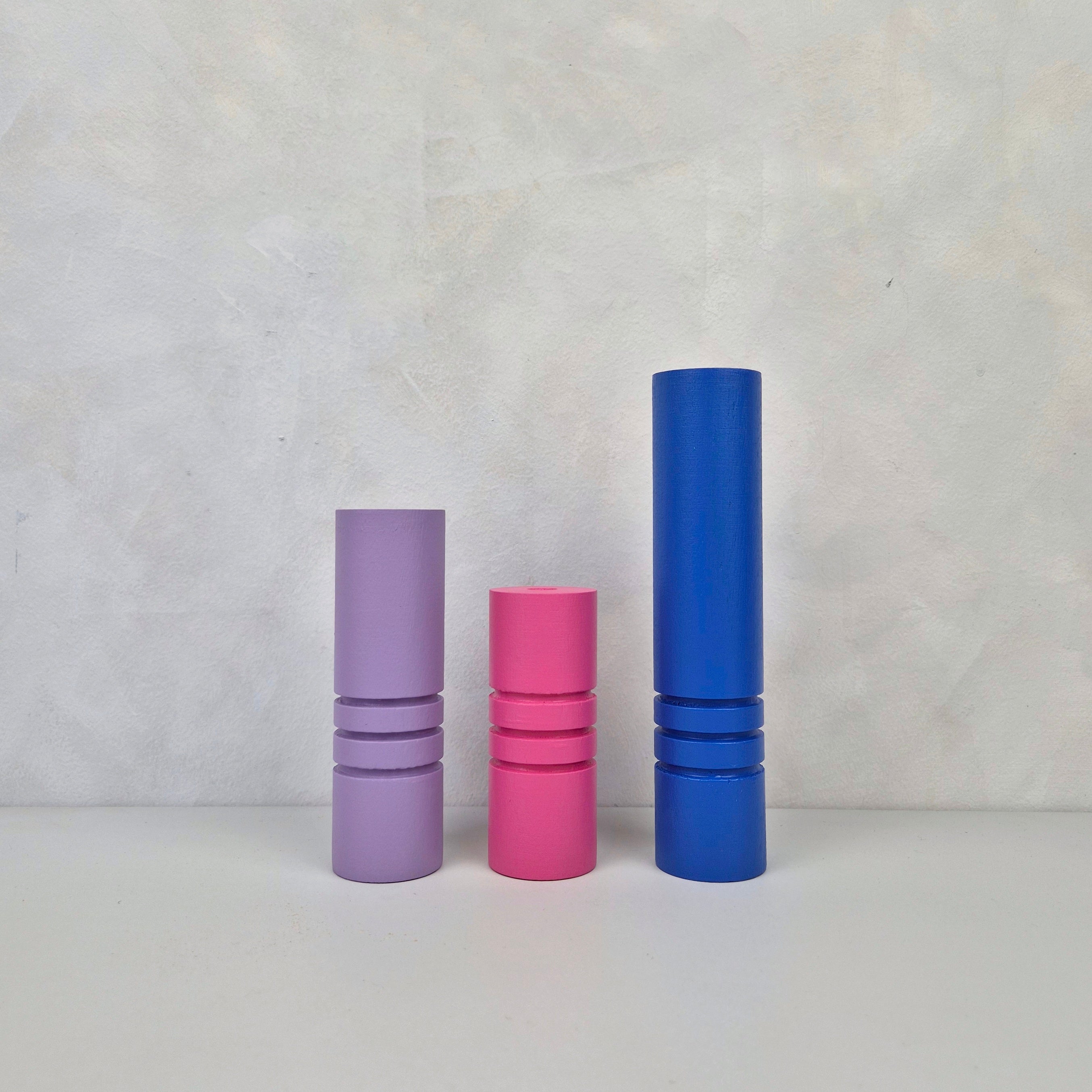 Three striped furniture legs in purple, pink, and blue, perfect for various furniture like IKEA Kallax, featuring wood material.