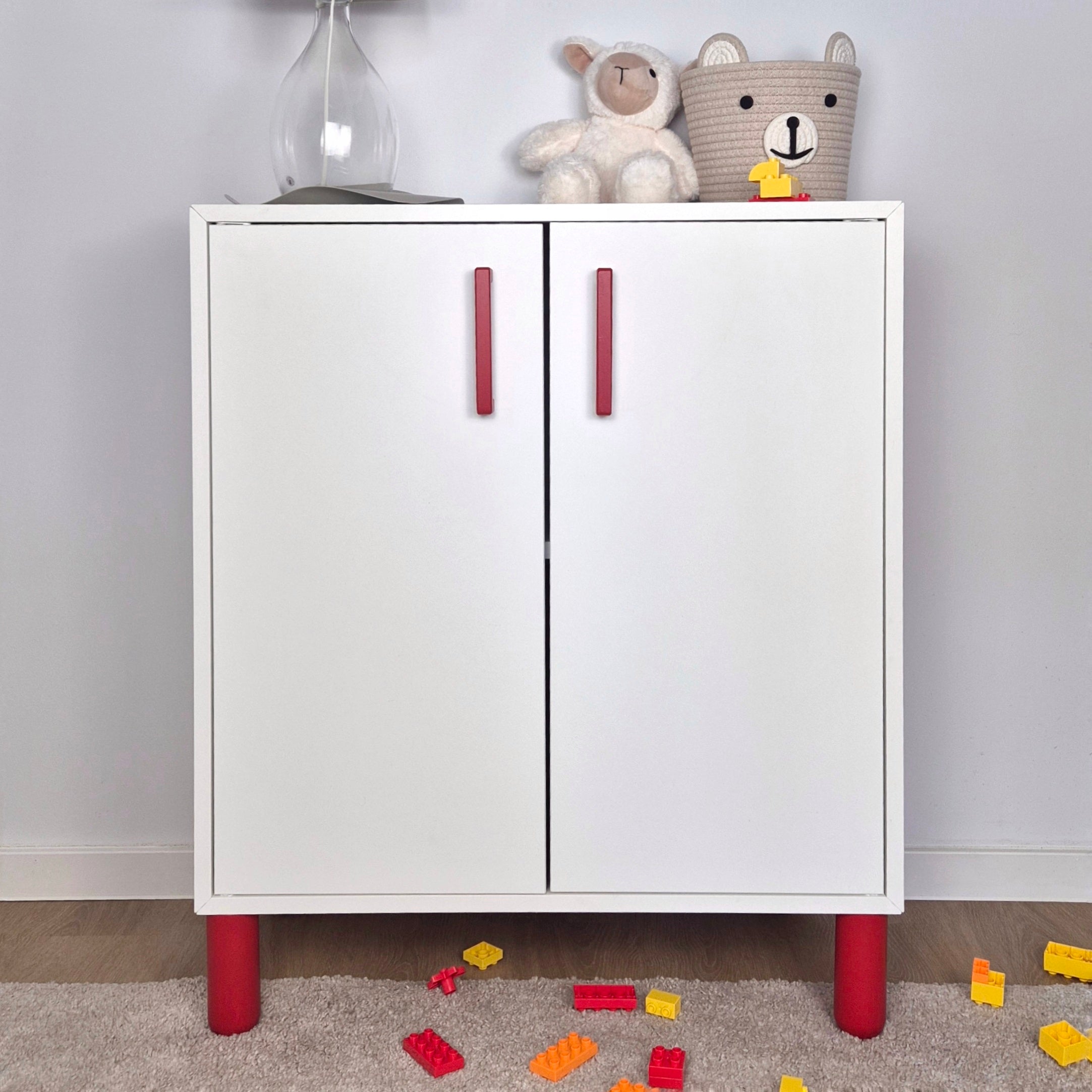 Red cabinet handles and legs on white IKEA EKET