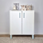White cabinet with mint handles and legs