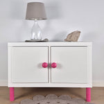 White cabinet with pink knobs