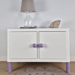 Round purple knob BALANCE on white IKEA Kallax storage unit