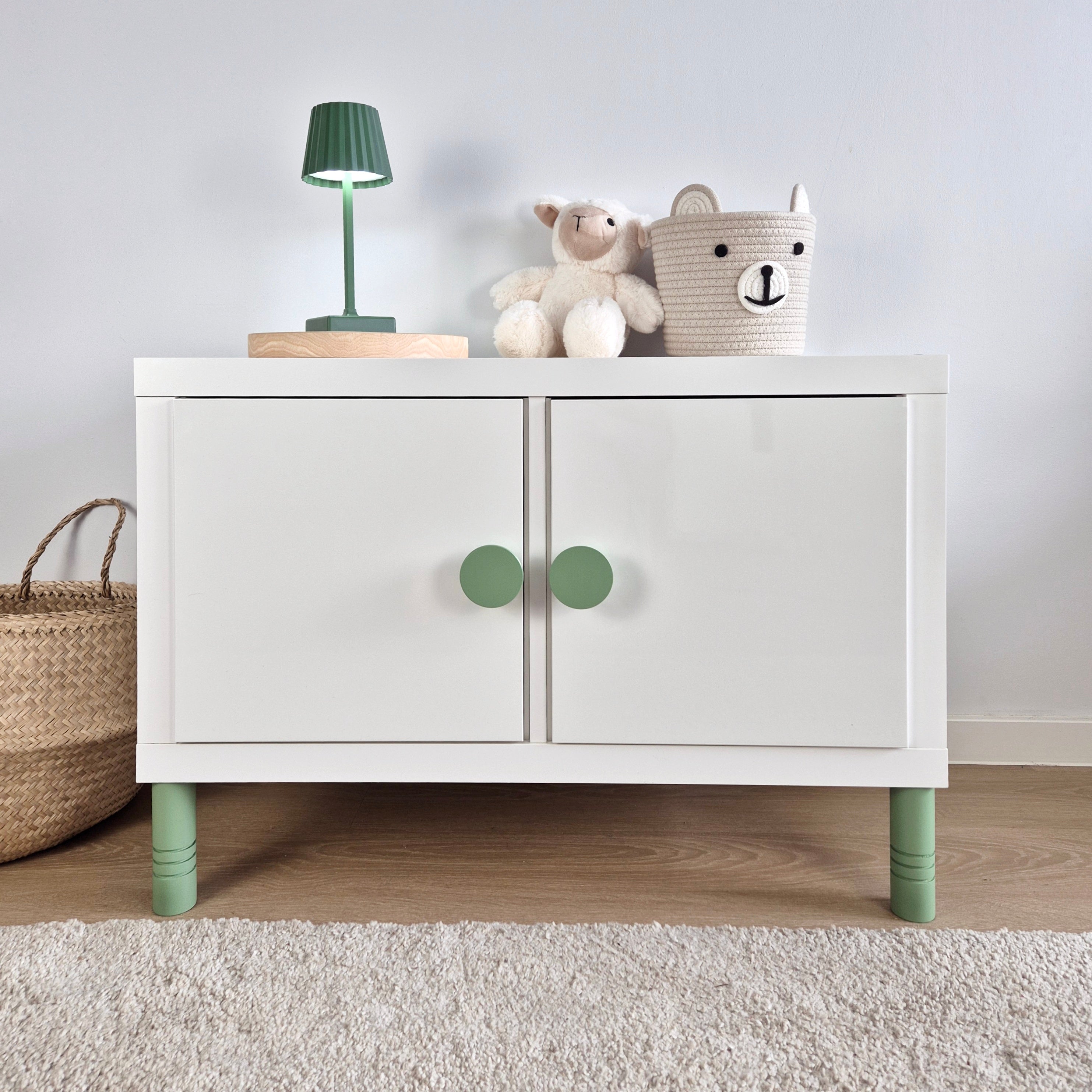 Kallax cabinet with green round knobs and legs