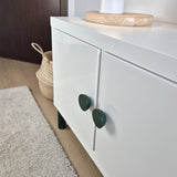 Round knobs on white IKEA cabinet