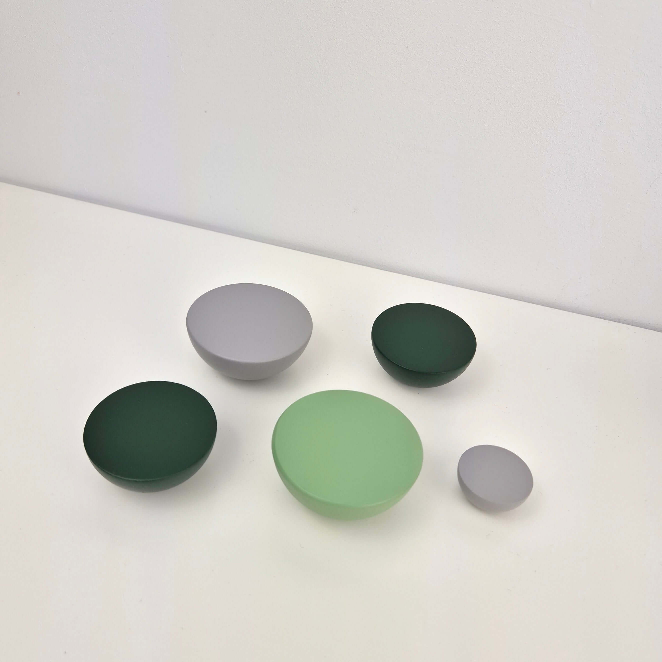 Grey and green round knobs