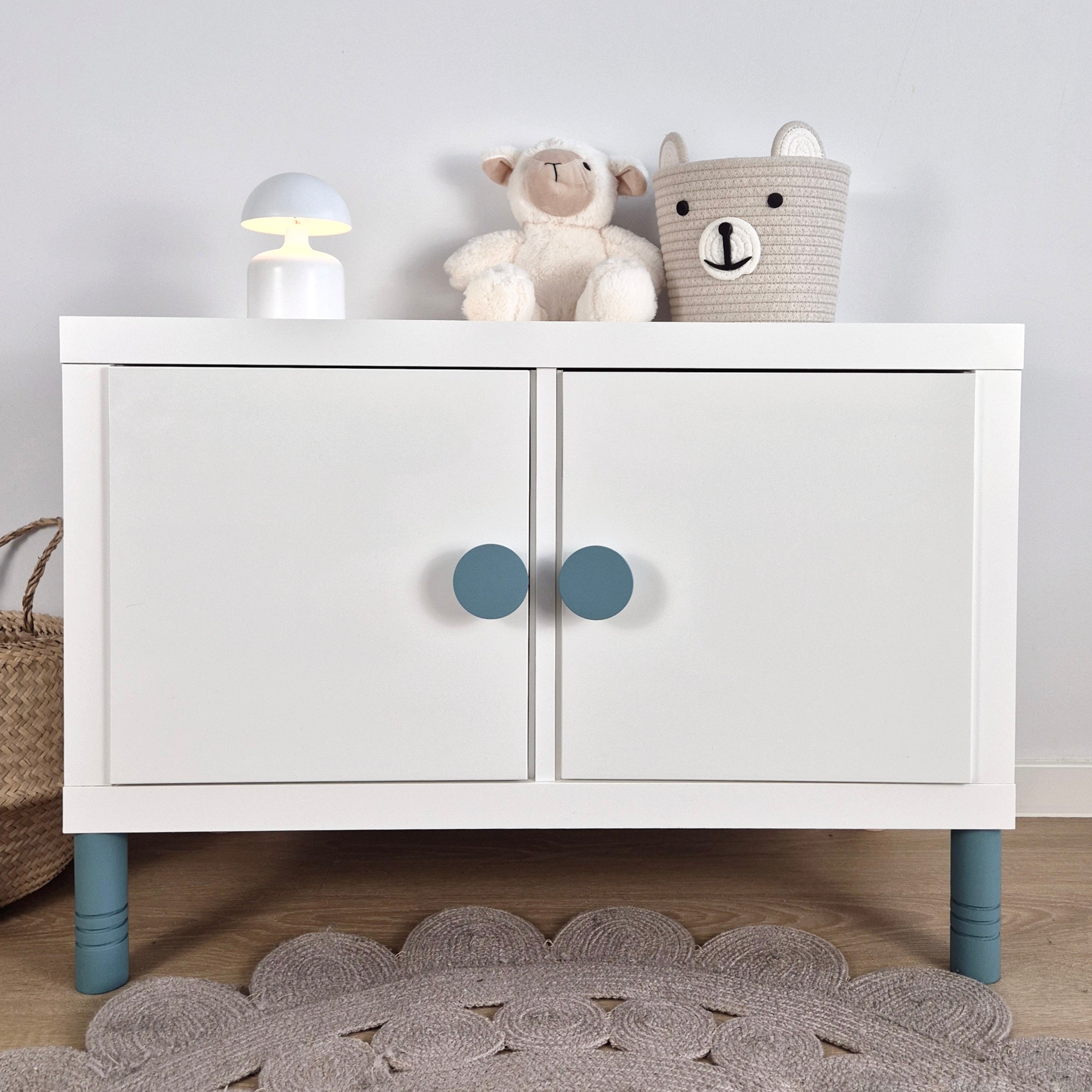 White cabinet with turquoise round knobs and legs