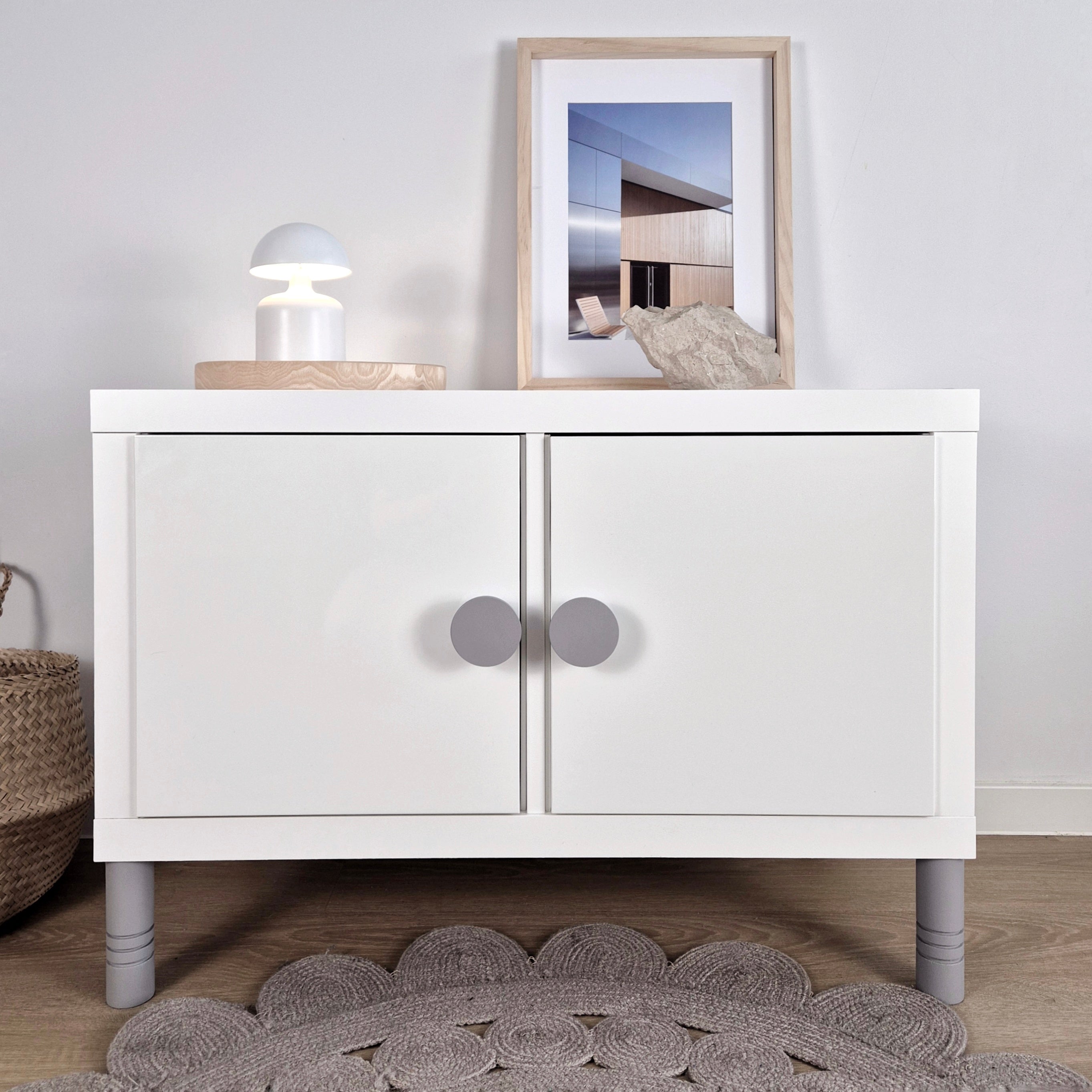 White KALLAX cabinet with grey knobs and legs