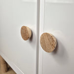Birch wood round knob BALANCE on white cabinet door