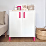 White cabinet with pink legs and handles in a room setting
