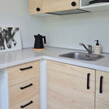 Kitchen with black cabinet handles