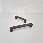 Dark brown cabinet handles