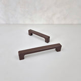 Dark brown cabinet handles