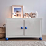 White IKEA Kallax cabinet with Round blue knobs