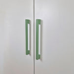 Long thin cabinet handles in green color