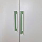 Long thin cabinet handles in green color