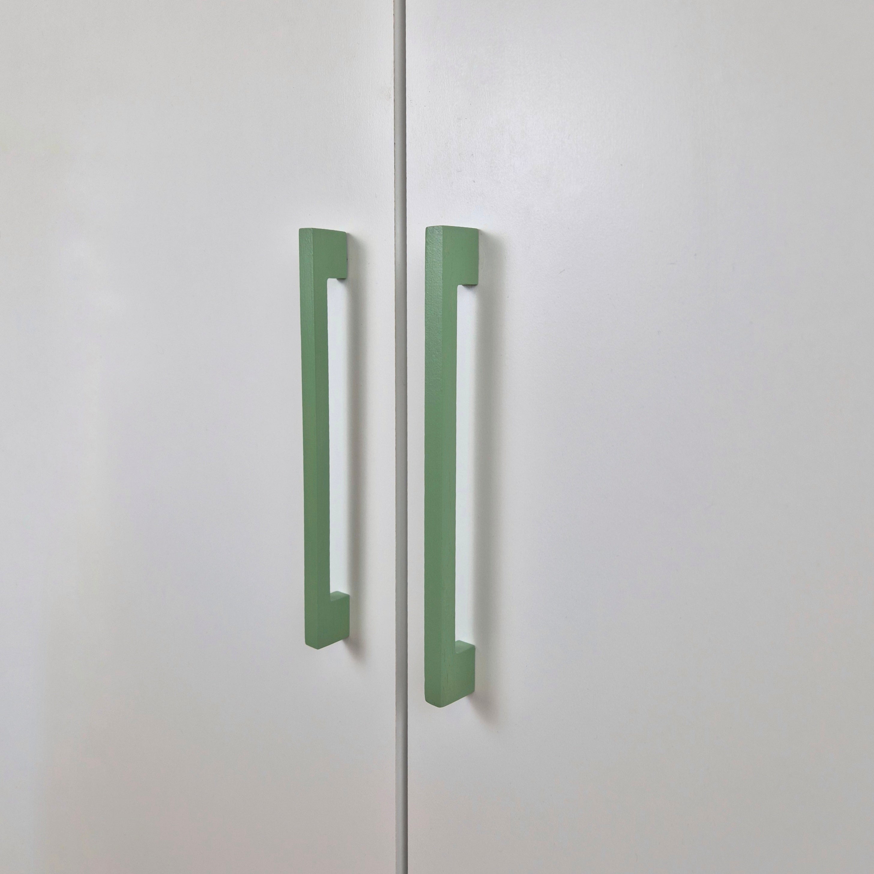 Long thin cabinet handles in green color