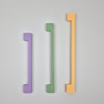 green, purple and yellow long thin cabinet handles