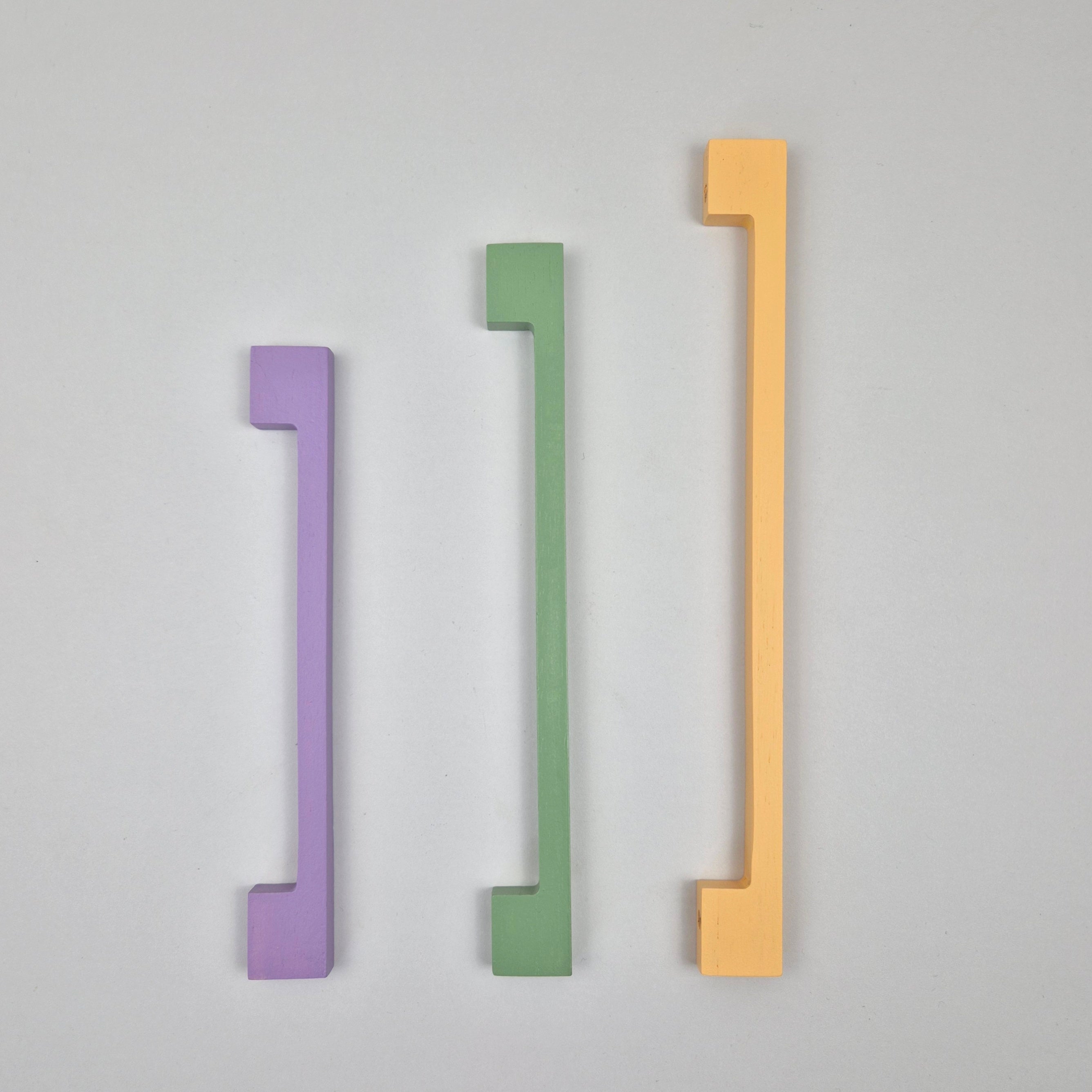 green, purple and yellow long thin cabinet handles