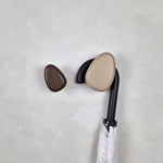 Brown wall hook with umbrella
