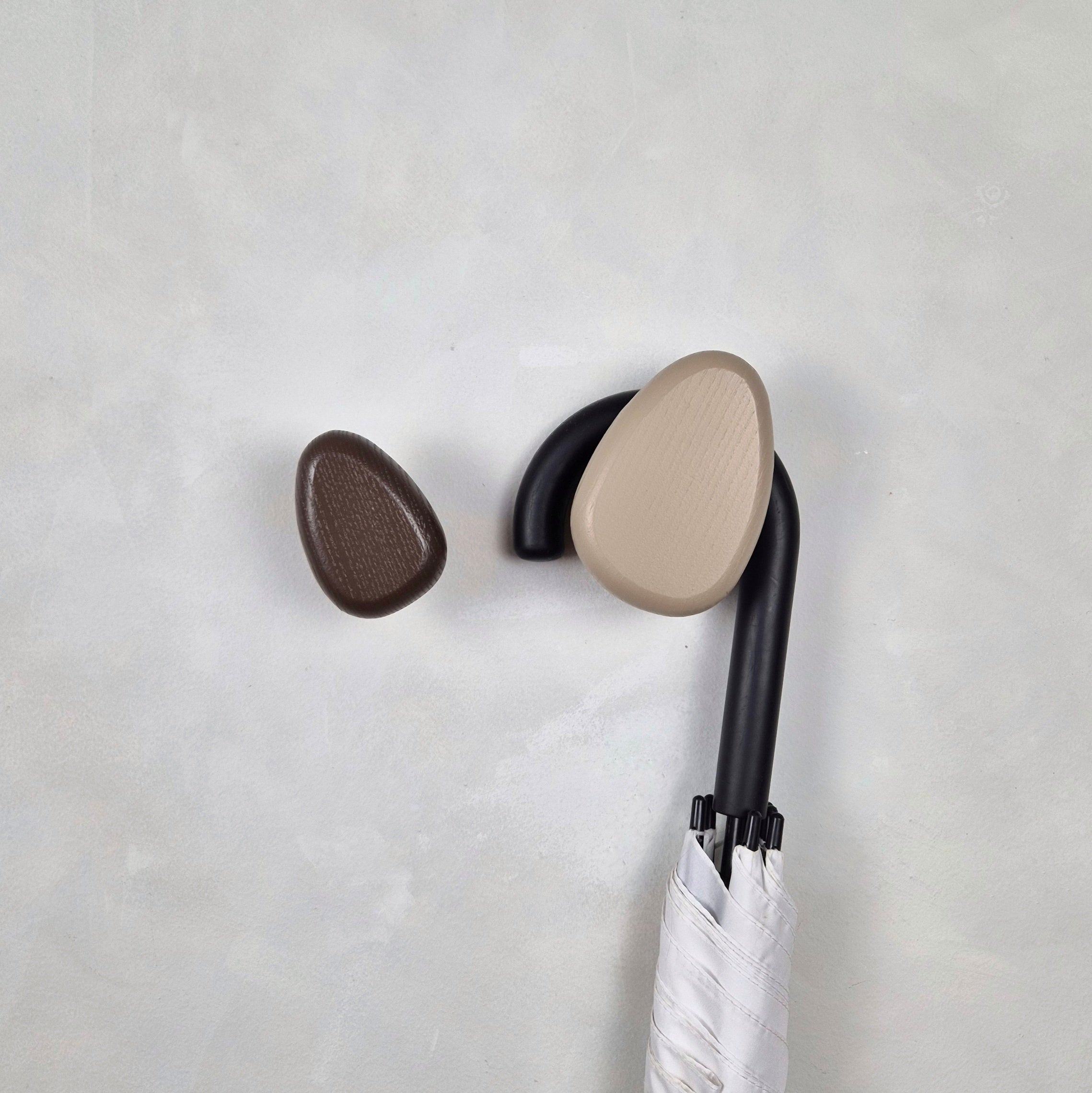 Brown wall hook with umbrella