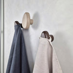 Brown wall hooks with towels