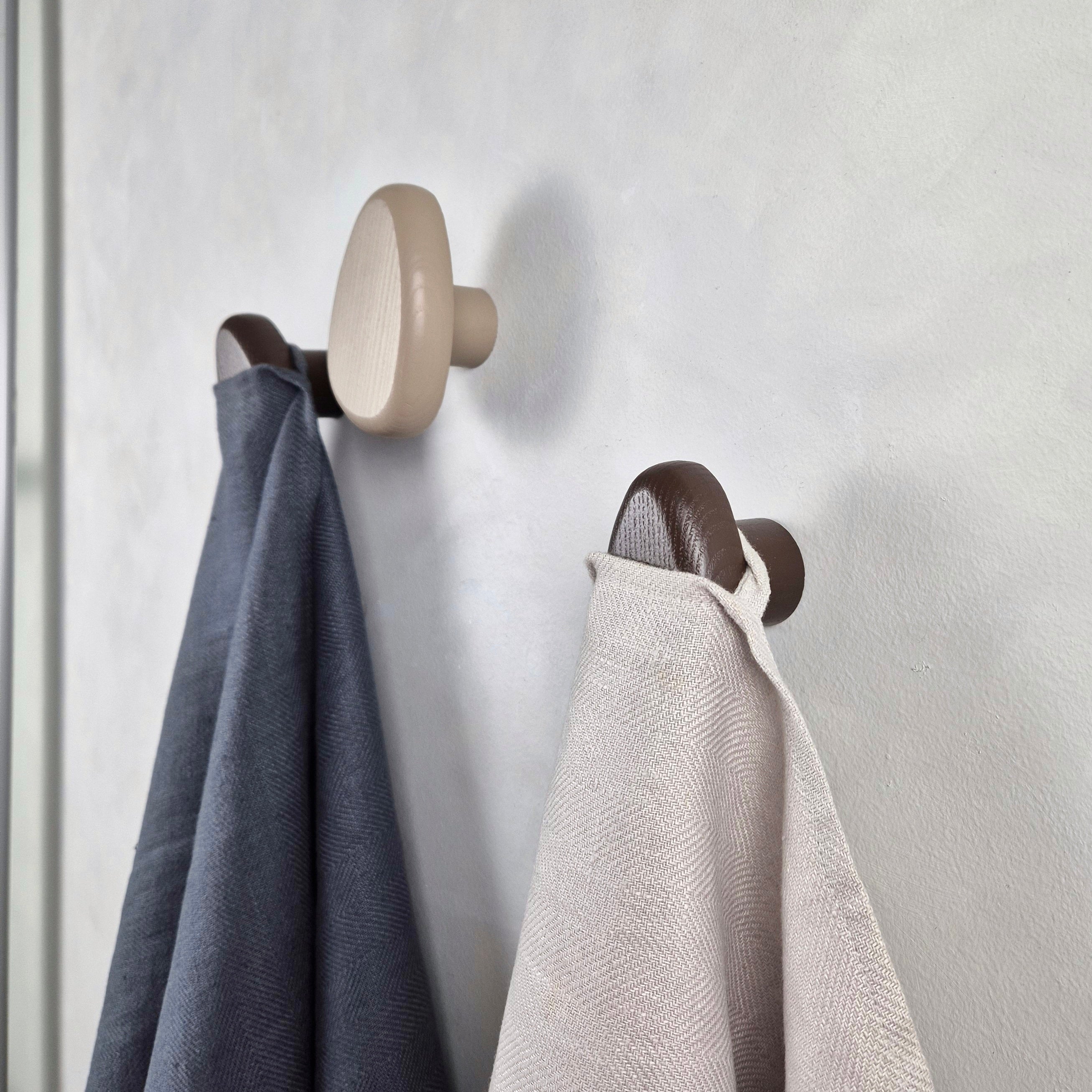 Brown wall hooks with towels