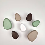 green, white and Brown wall hooks