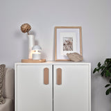 White cabinet with wooden furniture handle