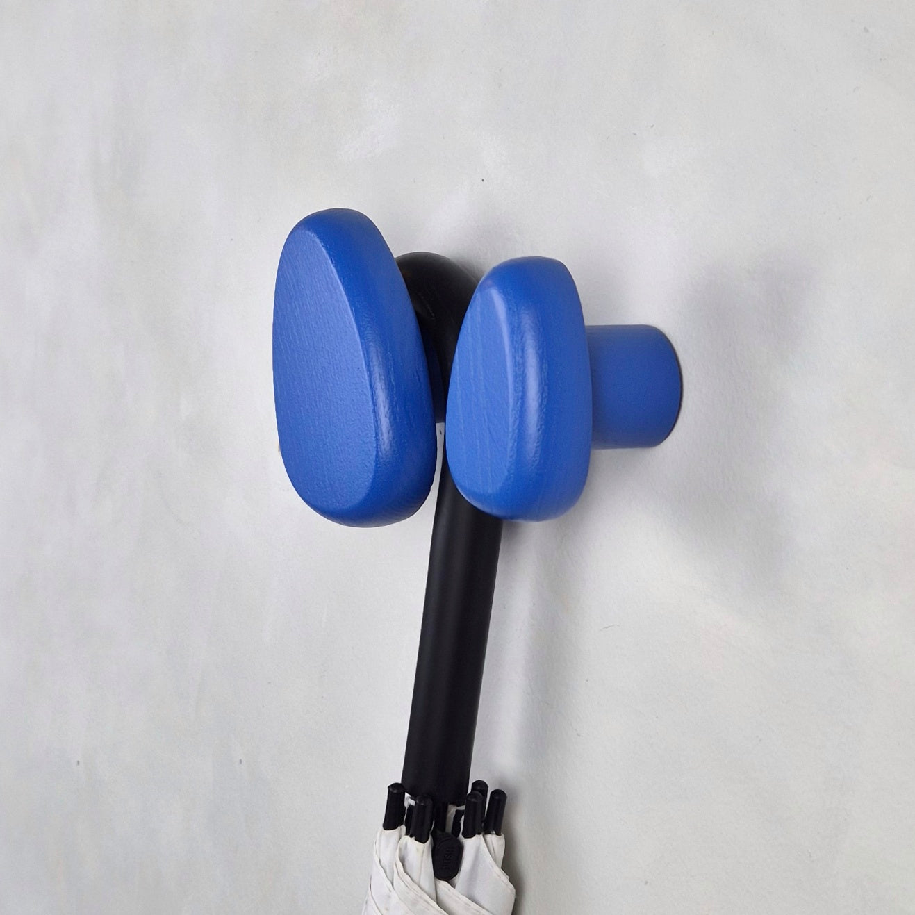Blue wall hooks with umbrella