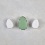 Green and white wall hooks