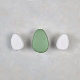 Green and white wall hooks