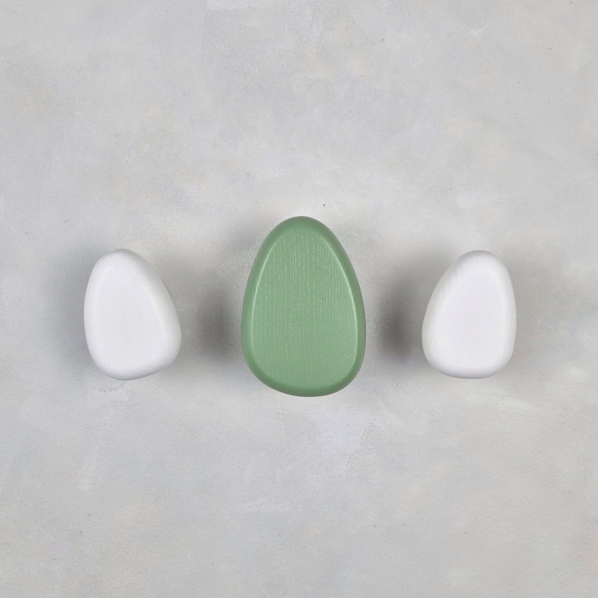 Green and white wall hooks