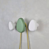 Green and white wall hooks