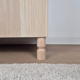 Wooden cabinet leg on IKEA Besta tv stand