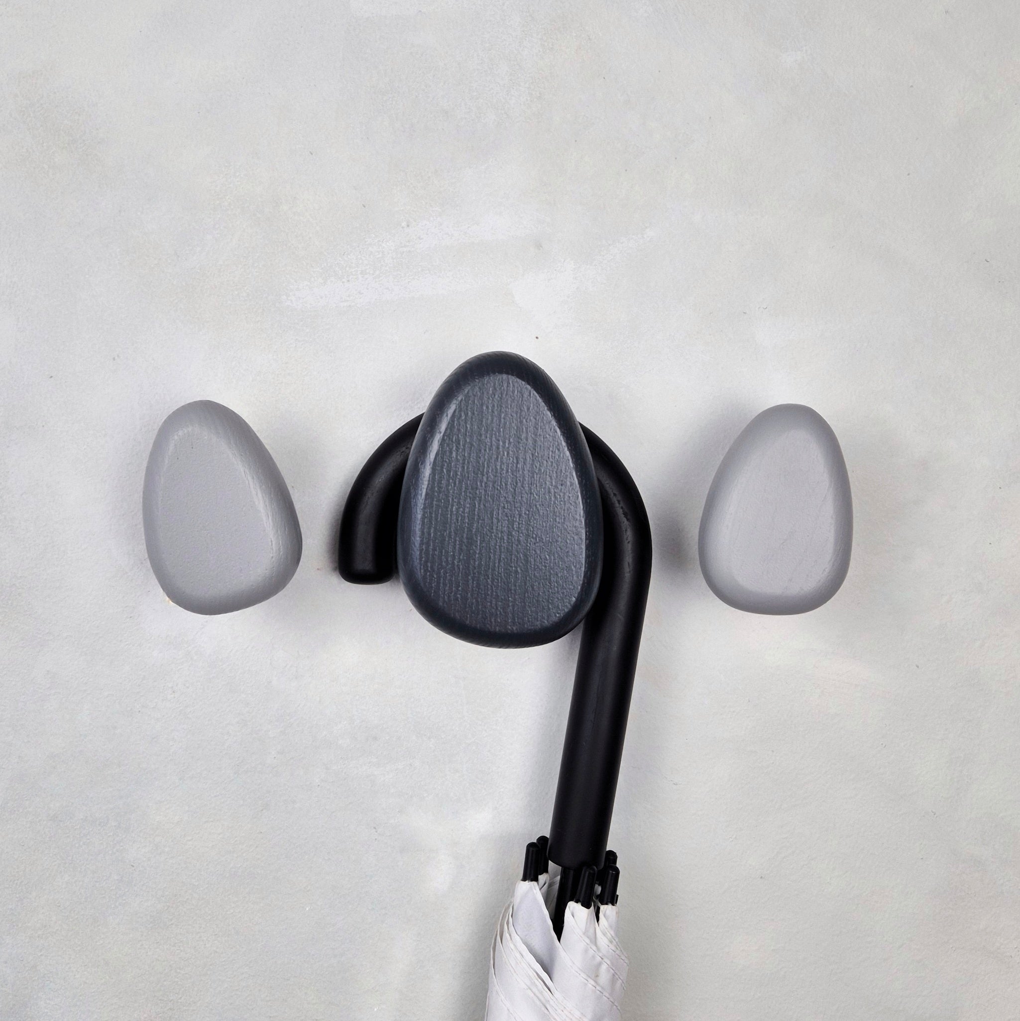 Light and dark grey wall hooks