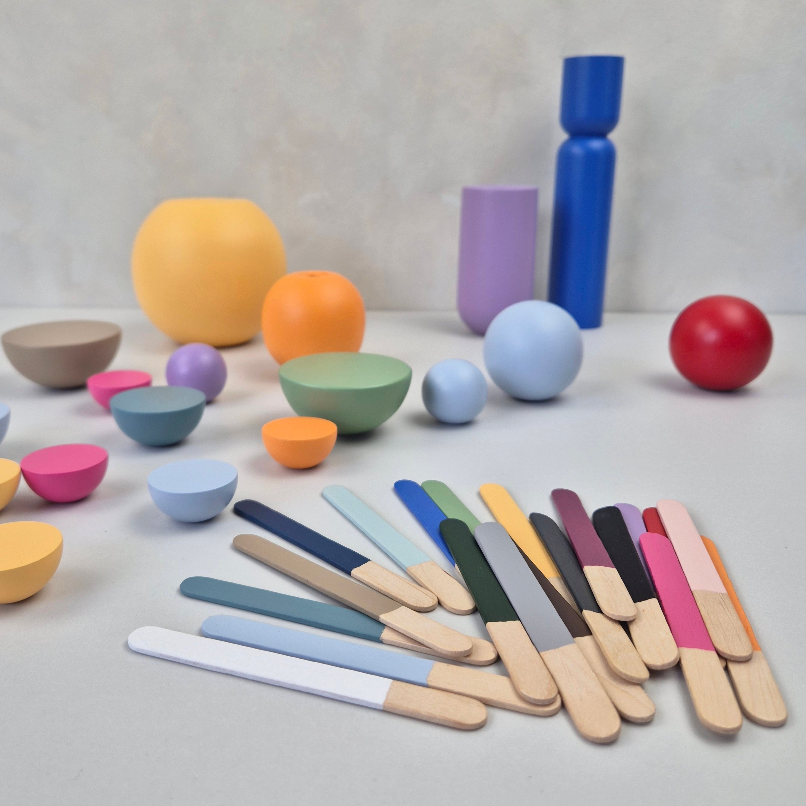 NAMII Paint Sample Set featuring colorful wooden sticks and various geometric shapes.