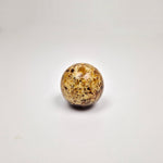 Round knob AMBER made from pressed amber with a smooth, rounded design, adding elegance to any furniture.