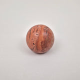 Red terracotta travertine cabinet knob with earthy rust tones