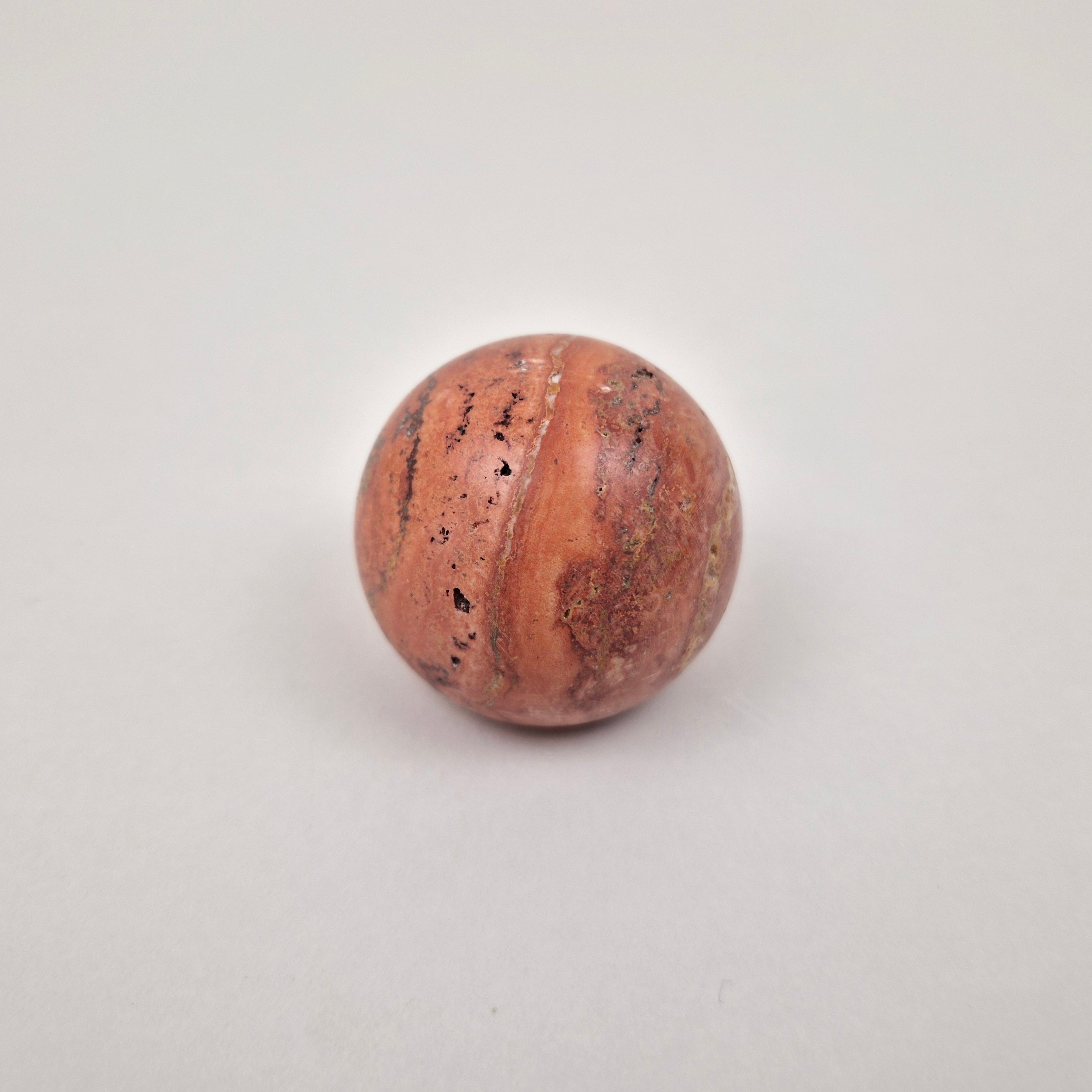 Red terracotta travertine cabinet knob with earthy rust tones
