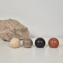 Collection of travertine cabinet knobs in four colours