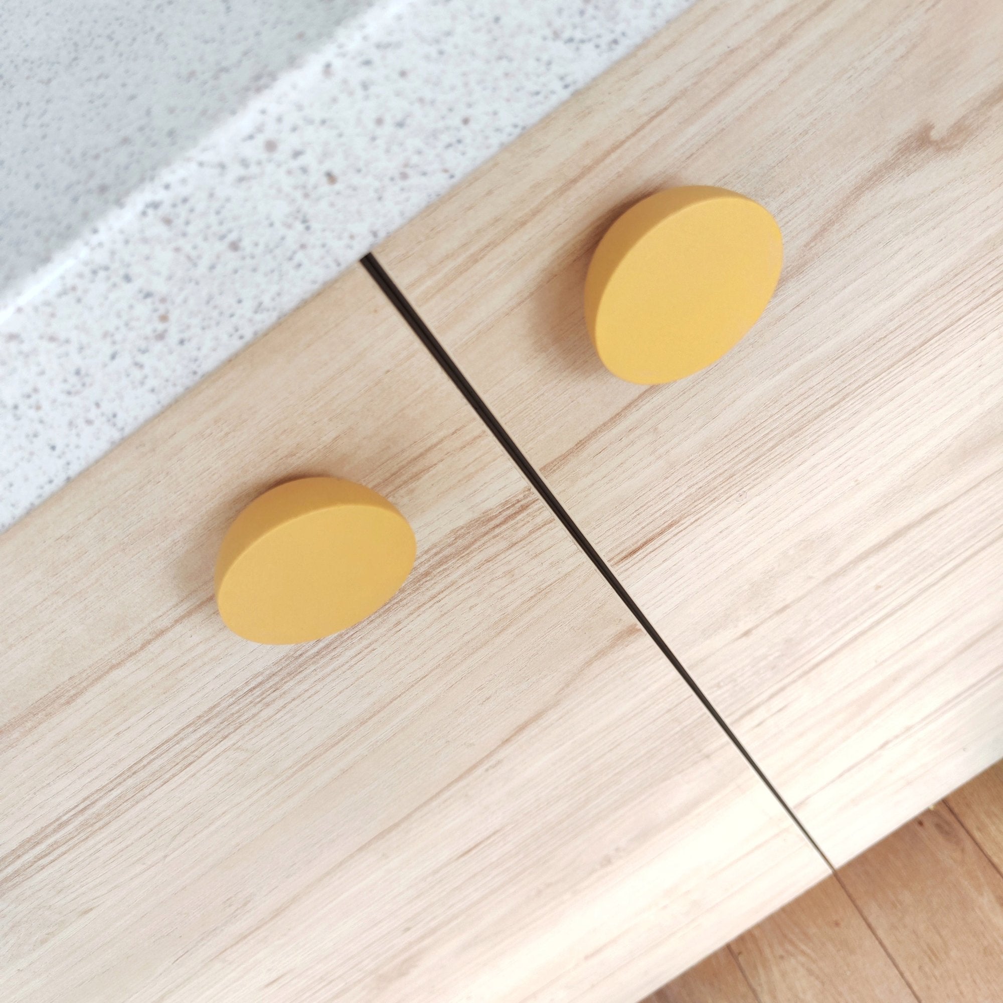 Bright yellow knobs for kids room furniture