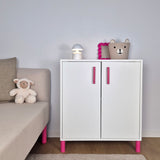 Cabinet with pink striped furniture legs, lamp, and cute decor in a cozy living room setting.