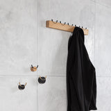 Coat rack and wall hooks for a lobby