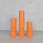 Striped orange Ball furniture legs in three sizes, perfect for bedside tables and cabinets.